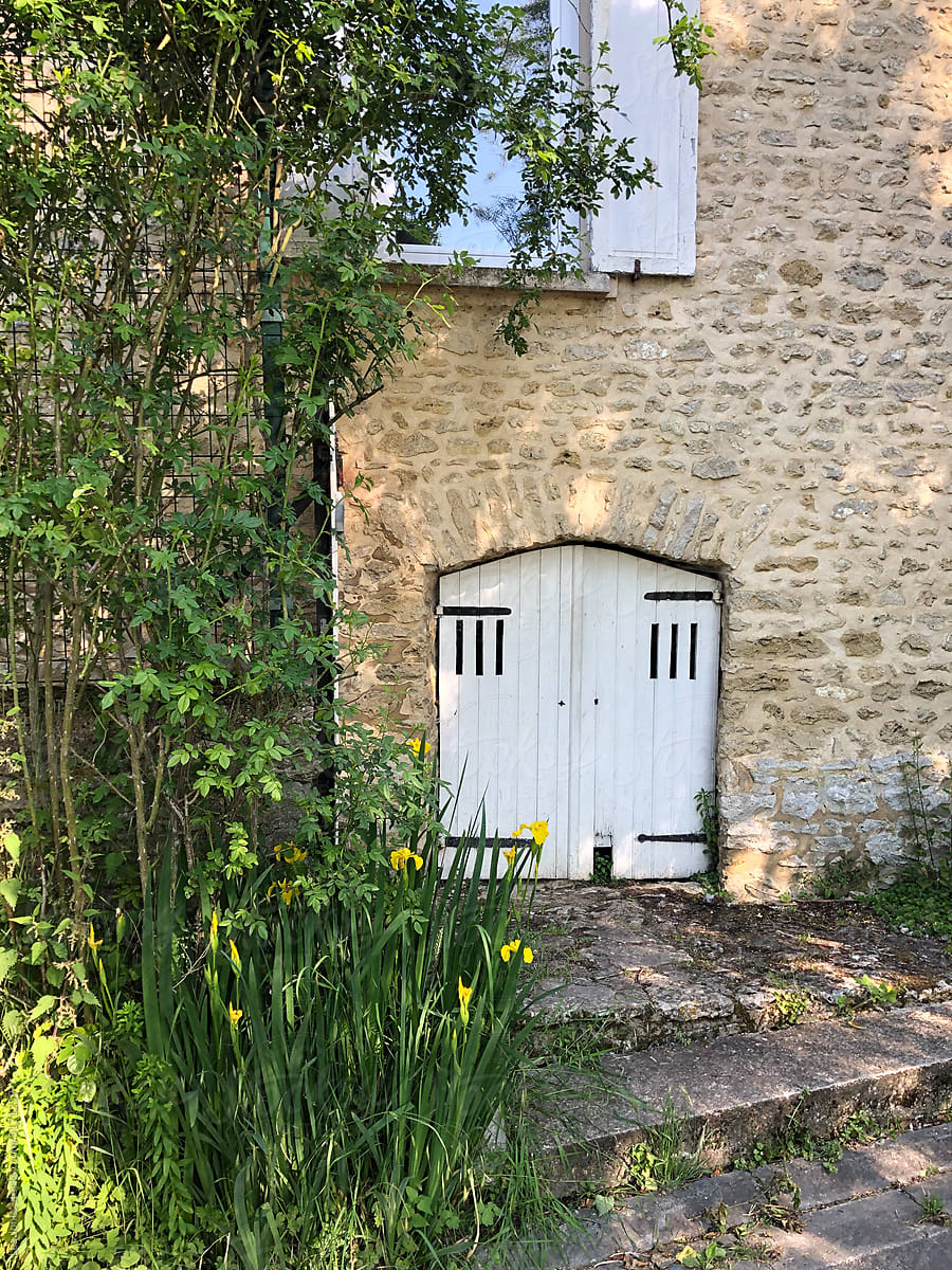 UGC of stone house with white doors and window