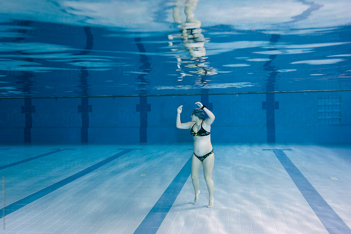 Pregnant woman swimming