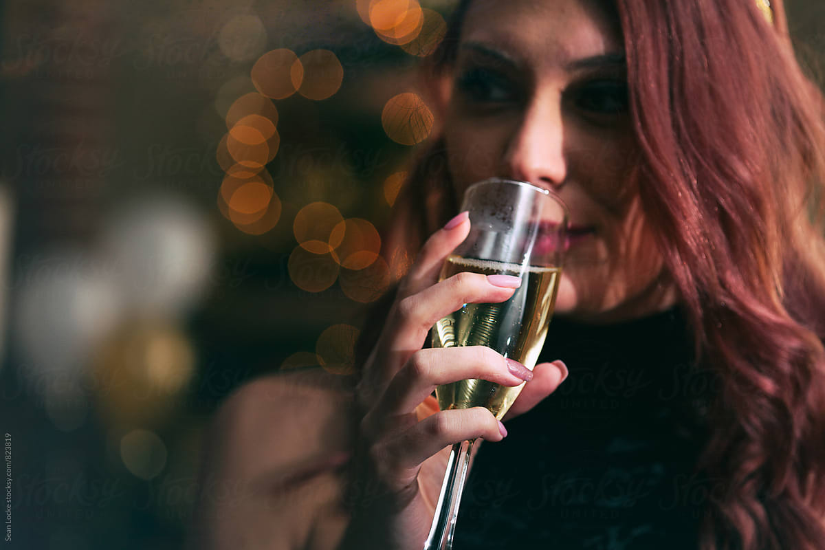 NYE: Sexy Lady Drinking Glass Of Champagne