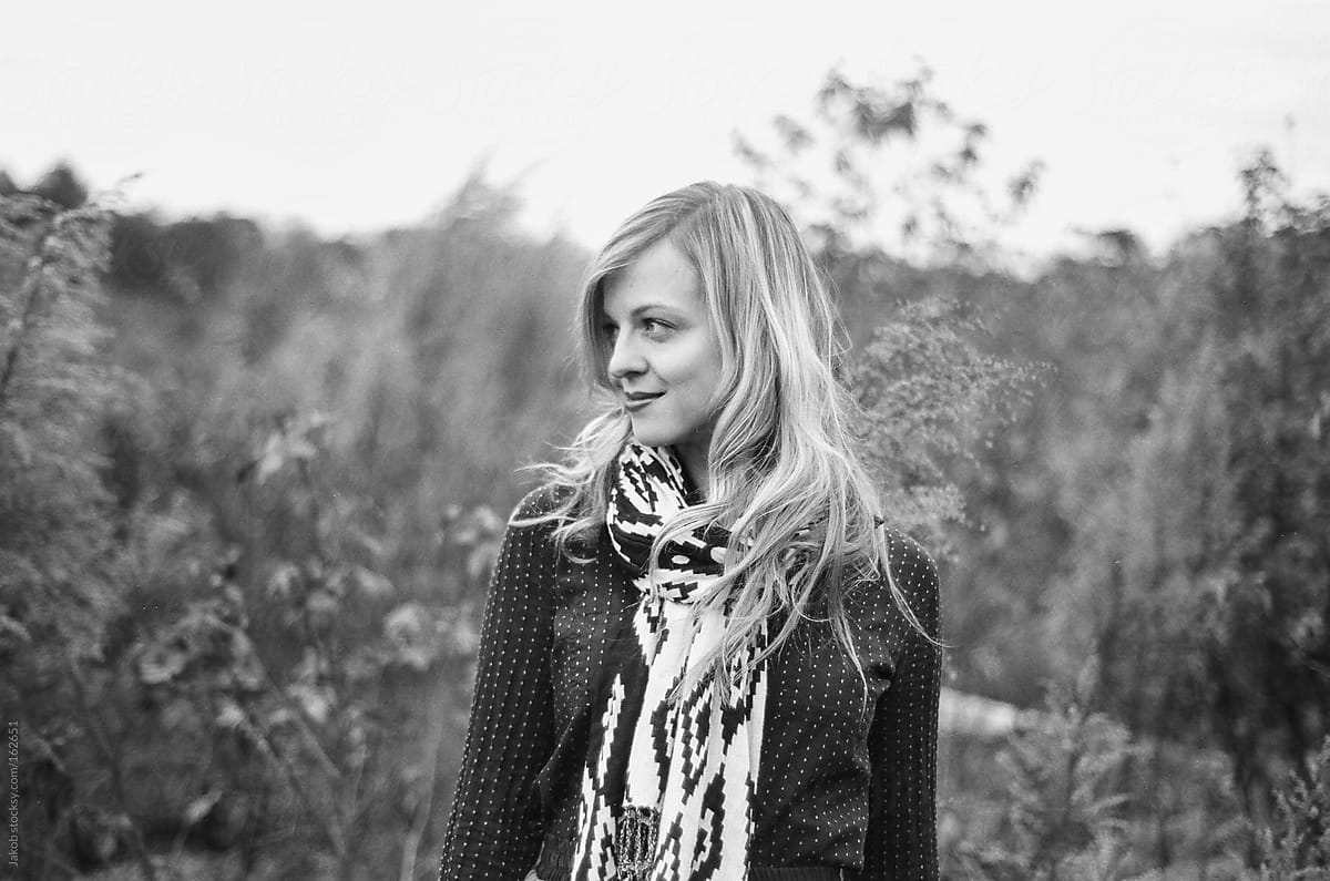 Black And White Portrait Of A Beautiful Blonde Woman Standing In A Field By Stocksy 
