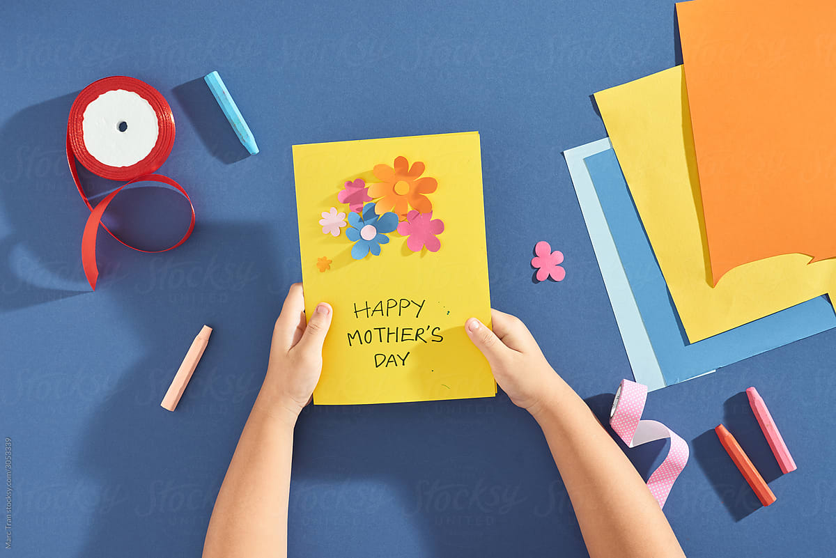 Child makes a greeting card for Mother
