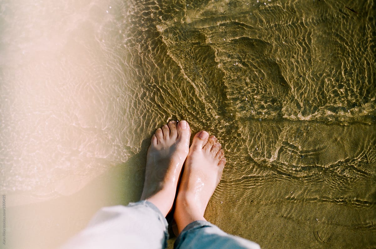 Feet in water at beach