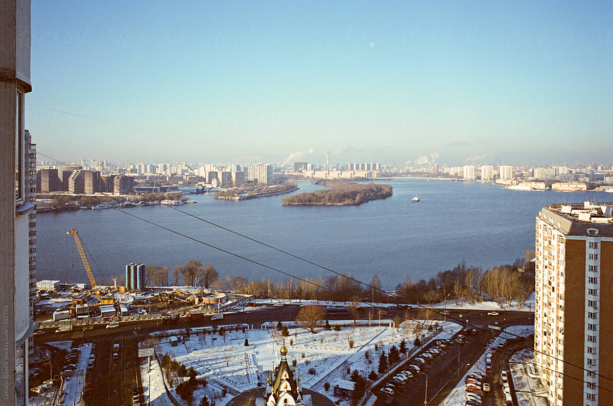 Wide cityscape featuring the Moskva River: cold sunny day after snow