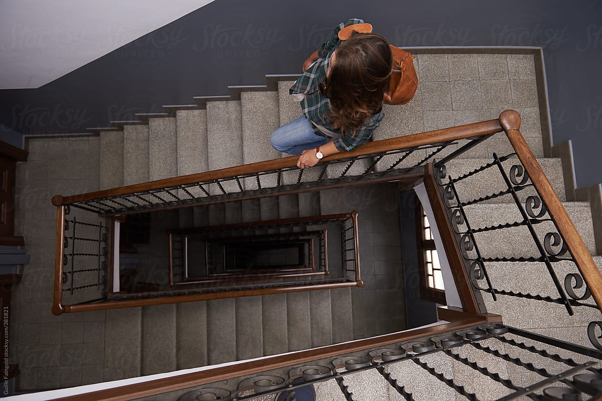 Girl walking down on stairwell