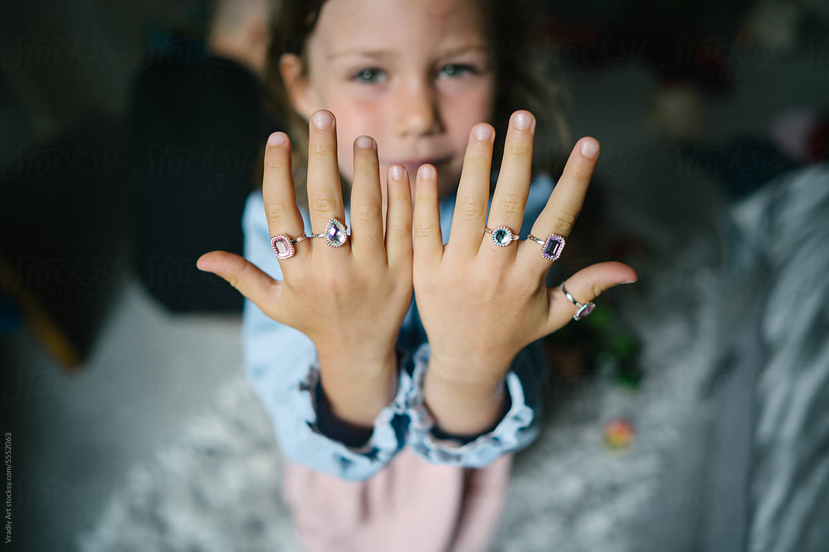 Little girl with rings on her hands