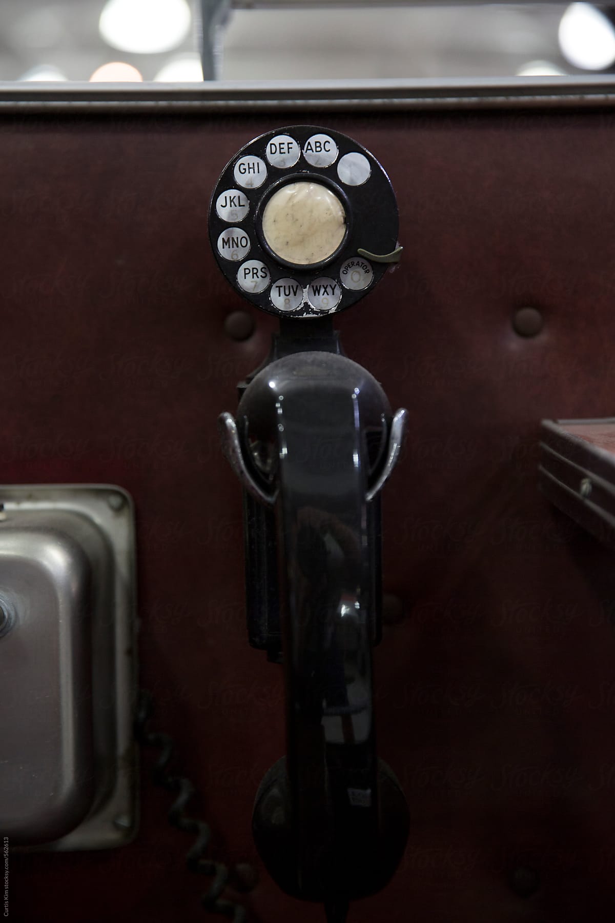 Retro vintage phone inside the door of a traveling car