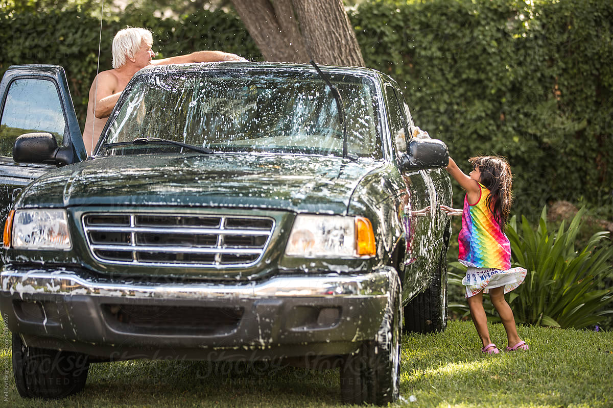 Girl washing a car