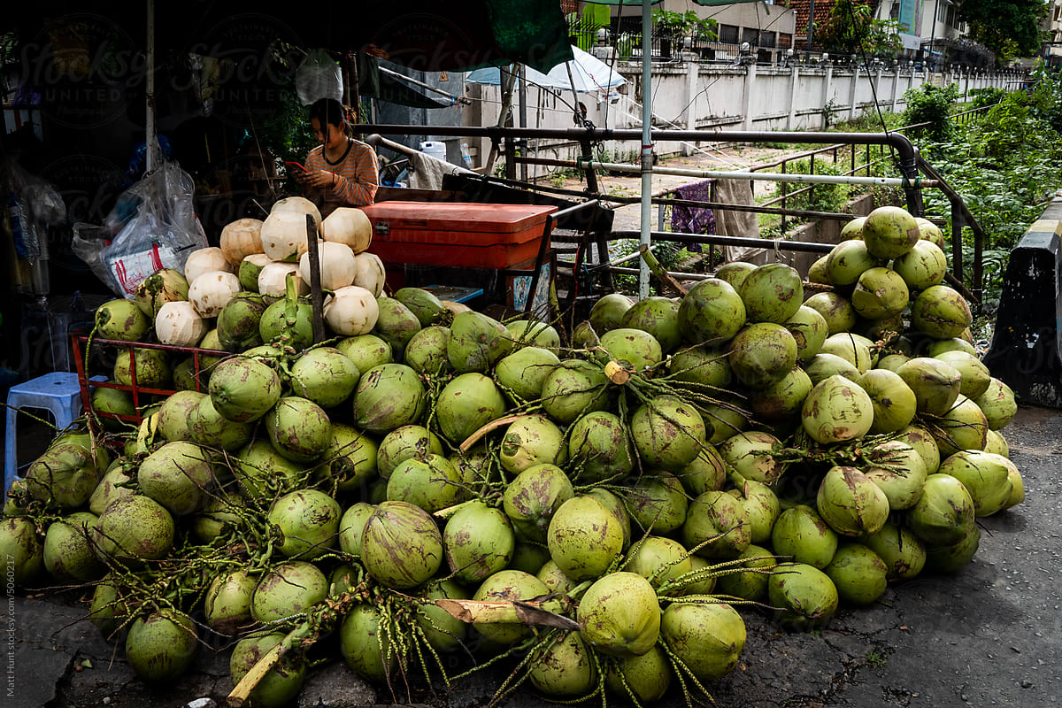 A coconut seller on the street in Phnom Penh, Cambodia