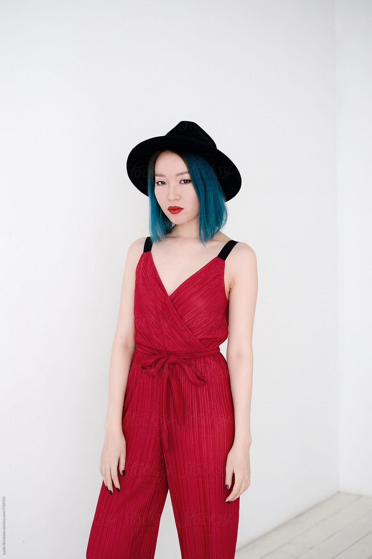 Portrait Of Asian Woman With Blue Hair Wearing Woolen Hat By Lyuba Burakova Stocksy United