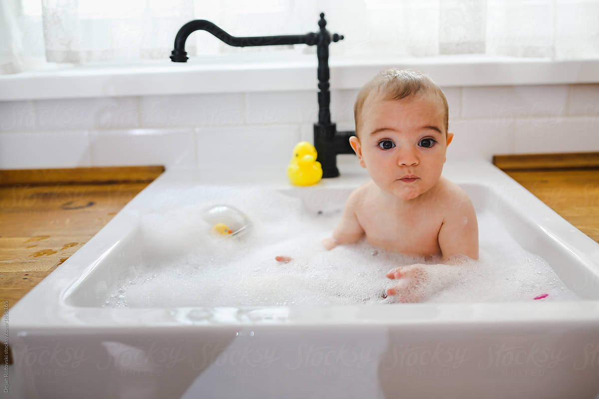 Baby Having A Bath In The Kitchen Sink By Dejan Ristovski