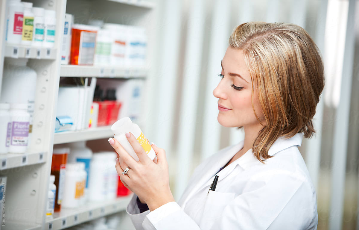 Pharmacy: Pharmacist Reading Prescription Label