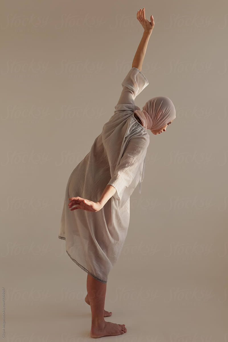 Puzzled woman performing strange dance