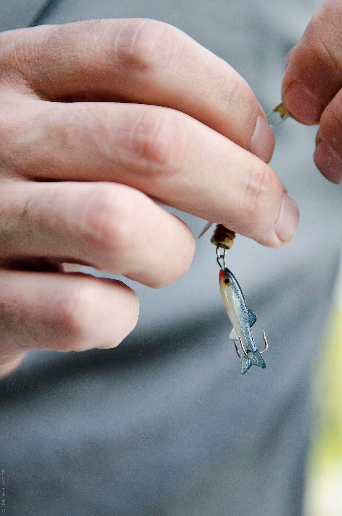 Man adds lure to fishing line