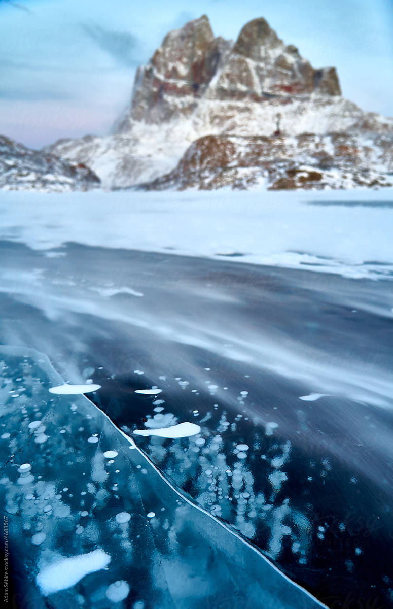 Ice bubble methane gas under Arctic ice, Uummannaq Island Greenland