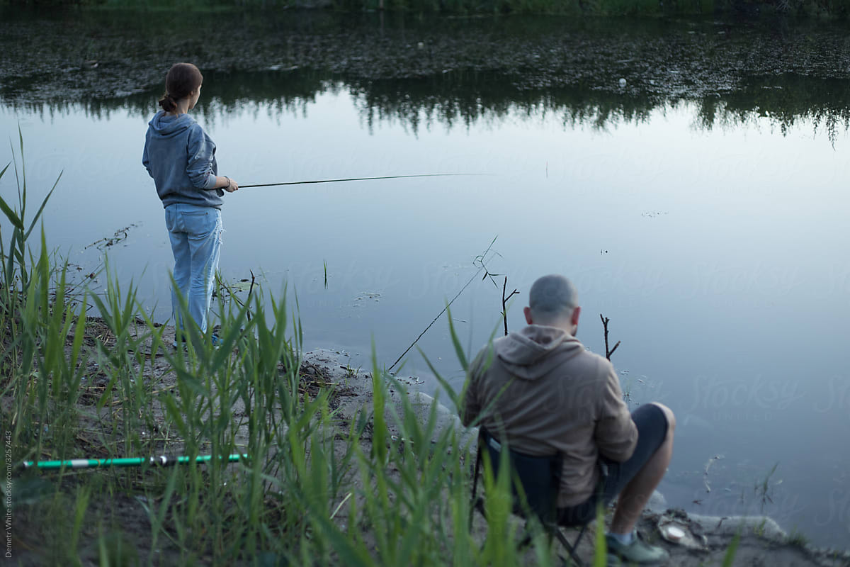 Boy And Girl Fishing by Stocksy Contributor Demetr White - Stocksy