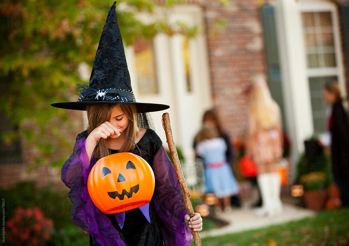 Halloween: Girl Looking Into Candy Bucket