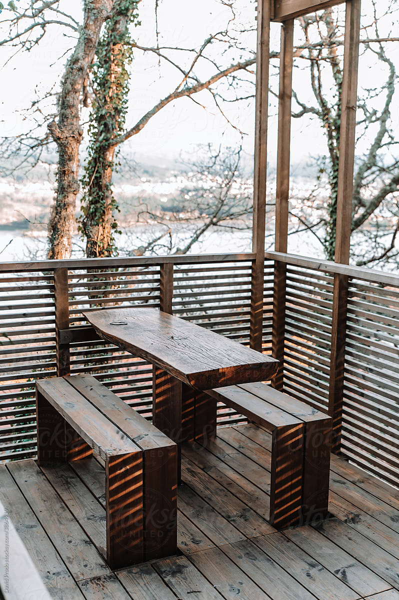 Wooden table and benches on terrace