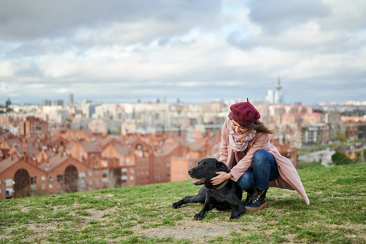 Girl with Labrador above city