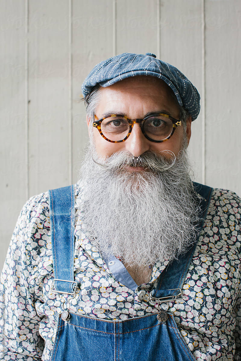 Outdoor Portrait Of Stylish Old Smiling Man With Long Grey Hipster