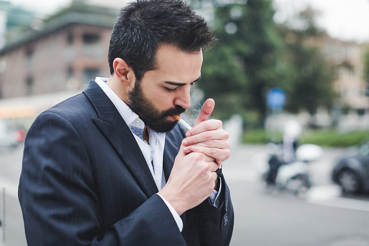Businessman smoking a Cigarette after a stressful day