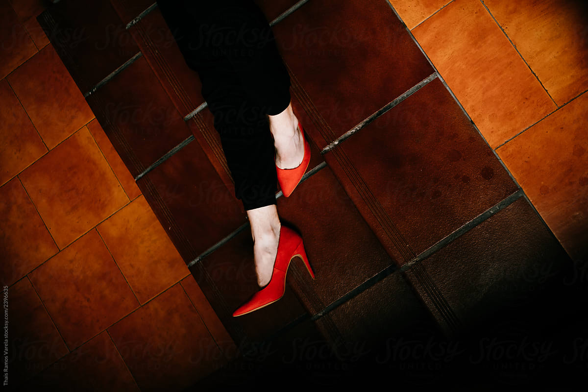 Very elegant red heels on brown background