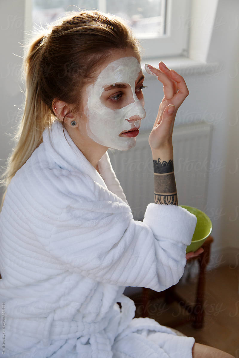 Woman applying mask after bath