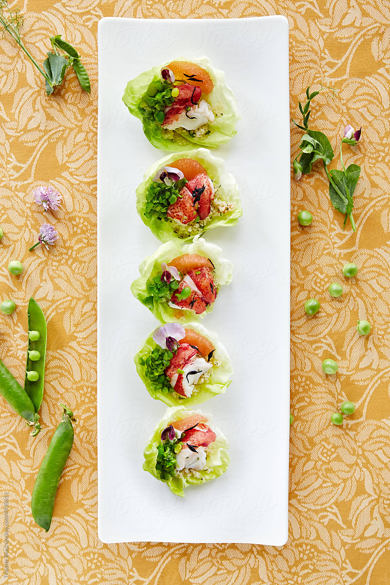Lobster salad cups with flowers and peas