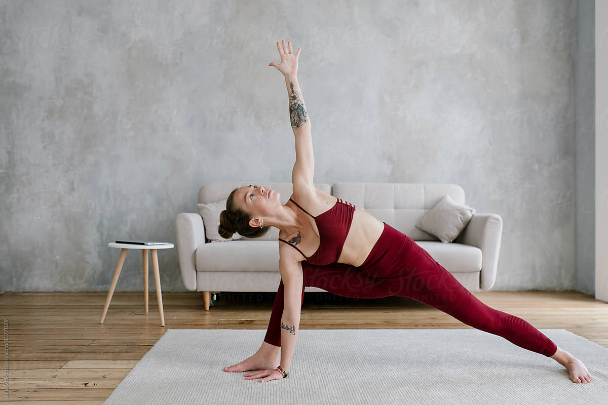 Woman At Triangle Yoga Pose