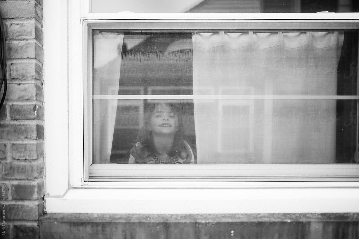 photo of girl through window