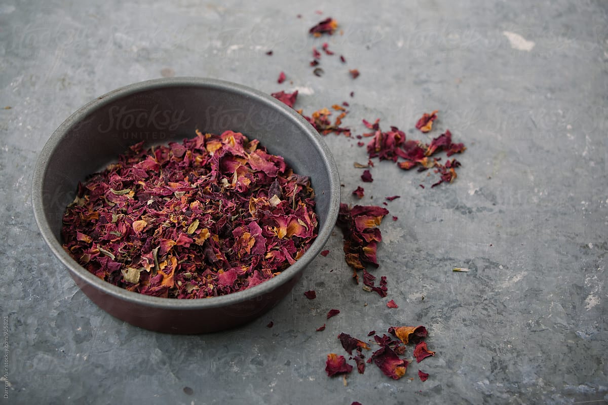 Dried rose petals in a bowl.