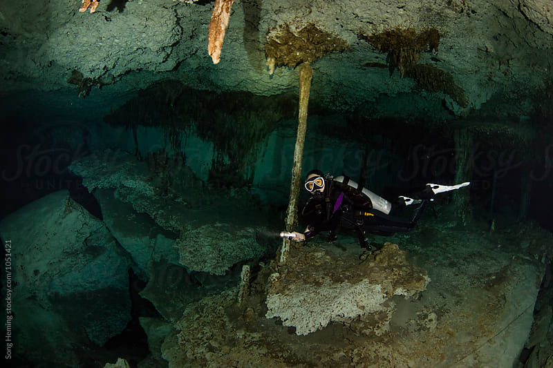 A scuba diver swimming in Mexico's  Cenote  Dos Ojos