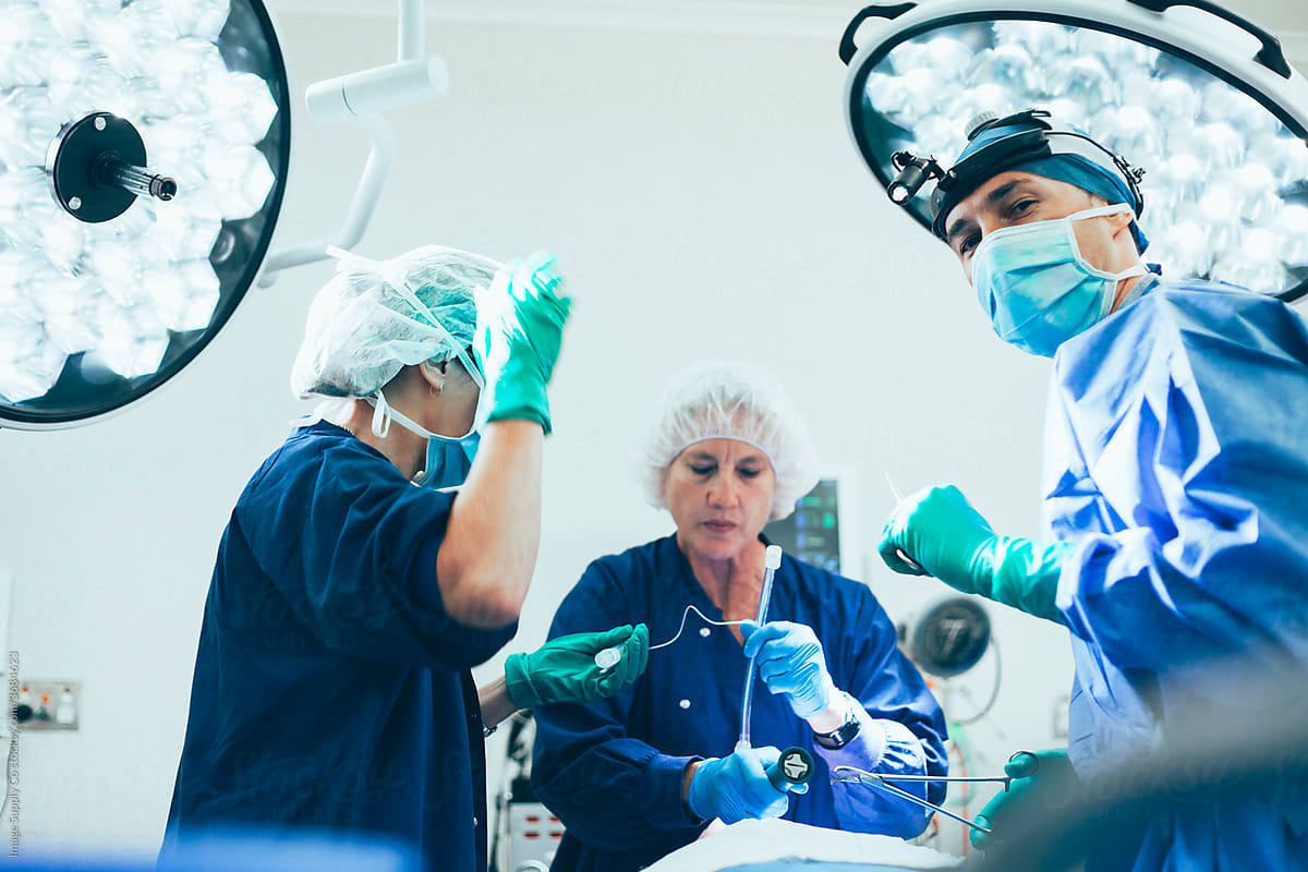 Surgeon and nurse in operating theatre