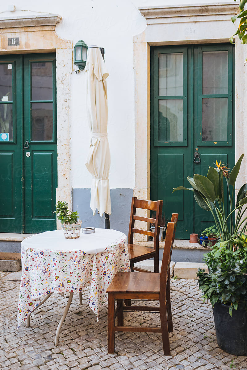 Empty table in the front of the restaurant in the streets of Portugal