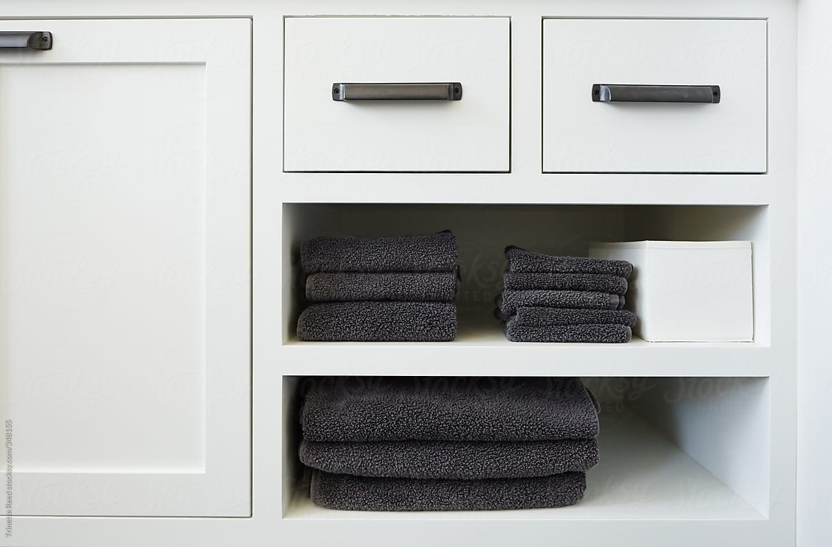 Detail of towels on bathroom shelf