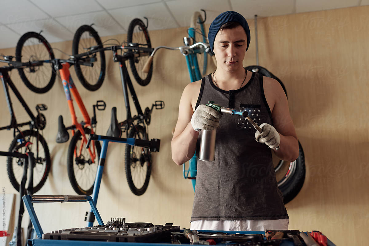 Bike Mechanic Cleaning Brakes