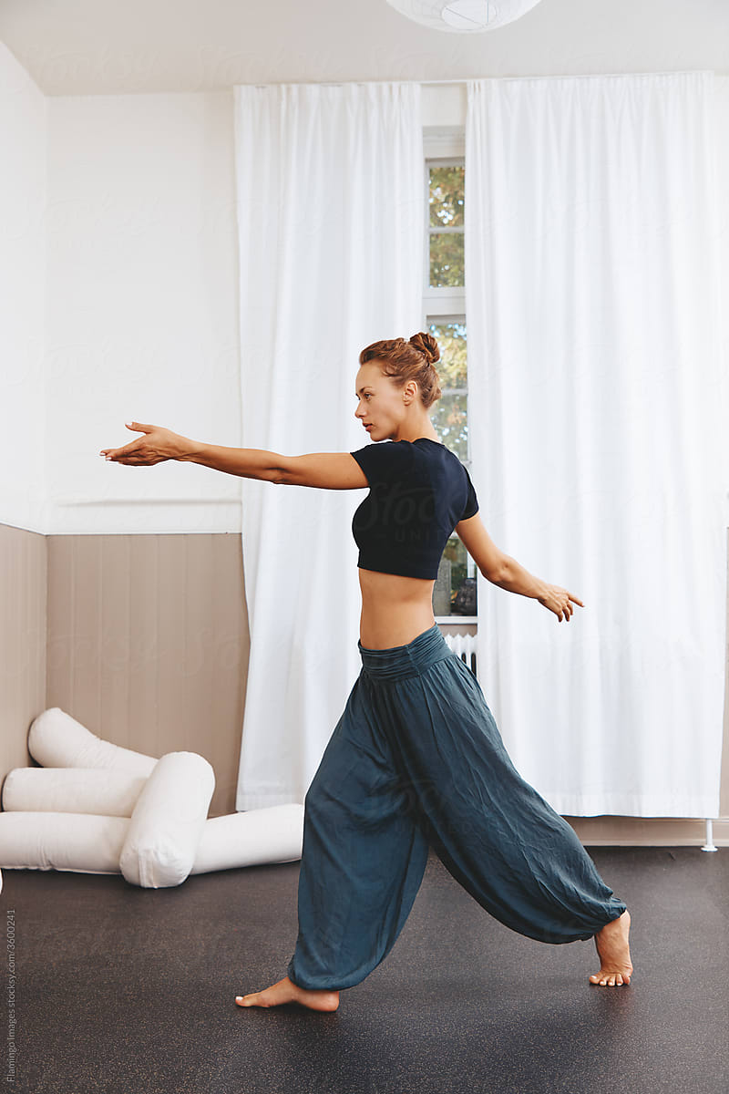 Woman practicing modern dance in her studio