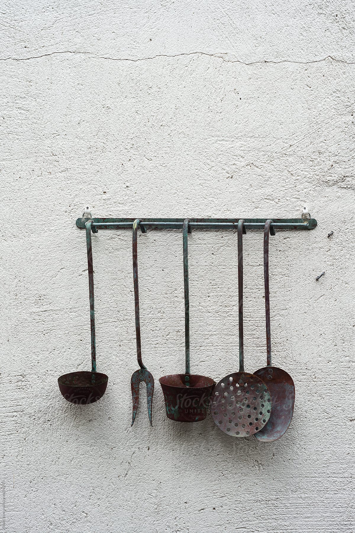 old kitchen utensils on a wall as art