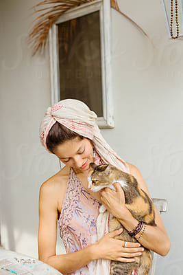 Girl Does Yoga Poses Dog In The Morning In Cozy Living Room by Stocksy  Contributor Nikita Sursin - Stocksy