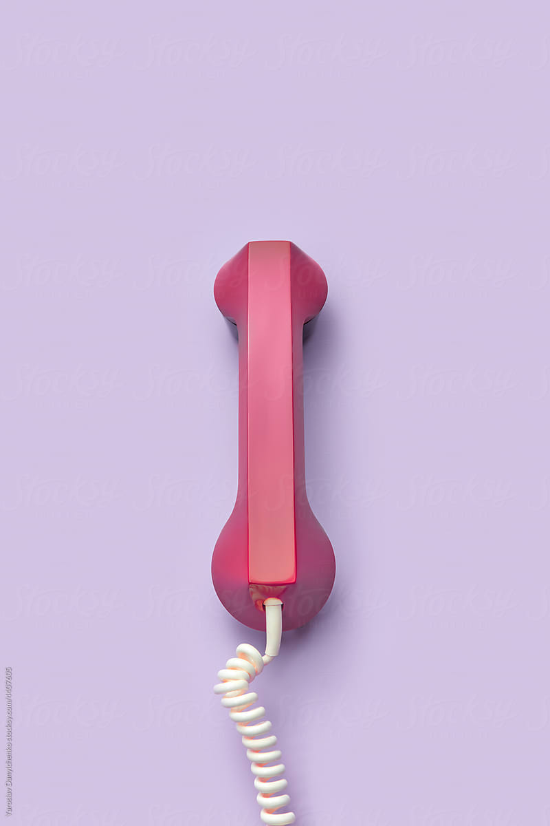 Plastic red telephone handset with white cord