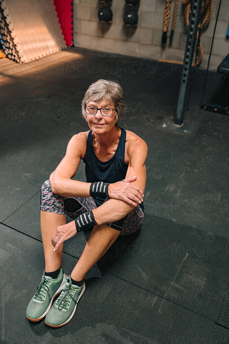 Senior Woman Stretches At Gym By Stocksy Contributor Rzcreative Stocksy 
