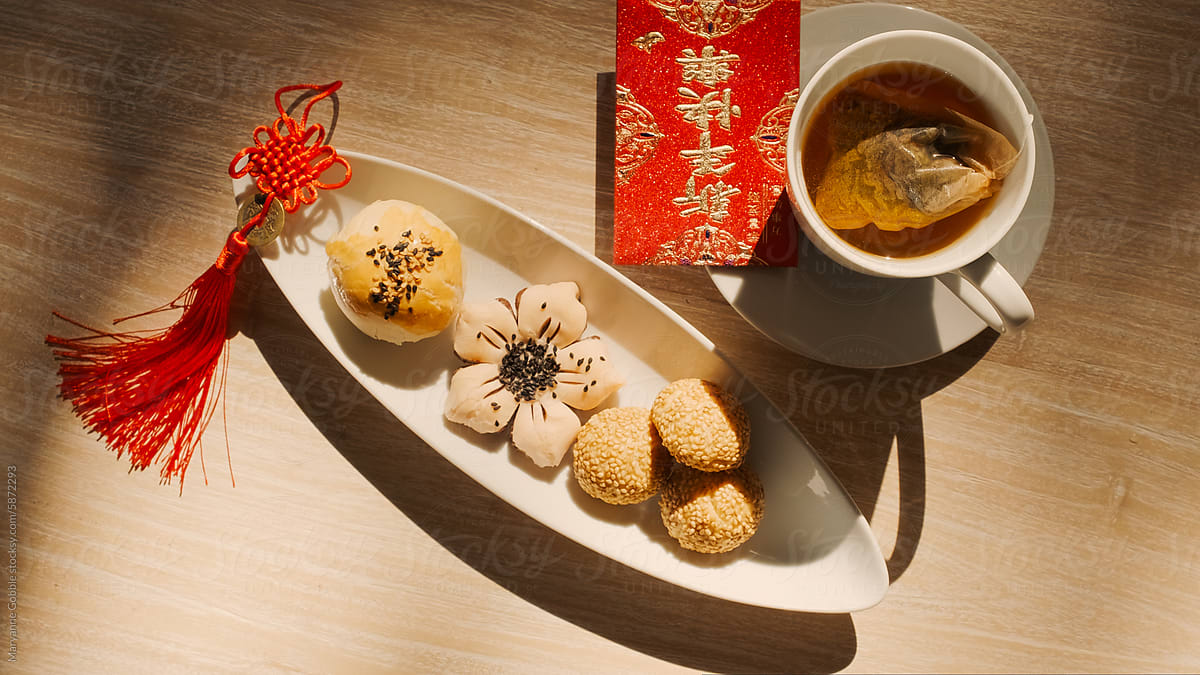 Chinese Pastries with Tea, Red Envelope and Lucky Knot Lunar New Year