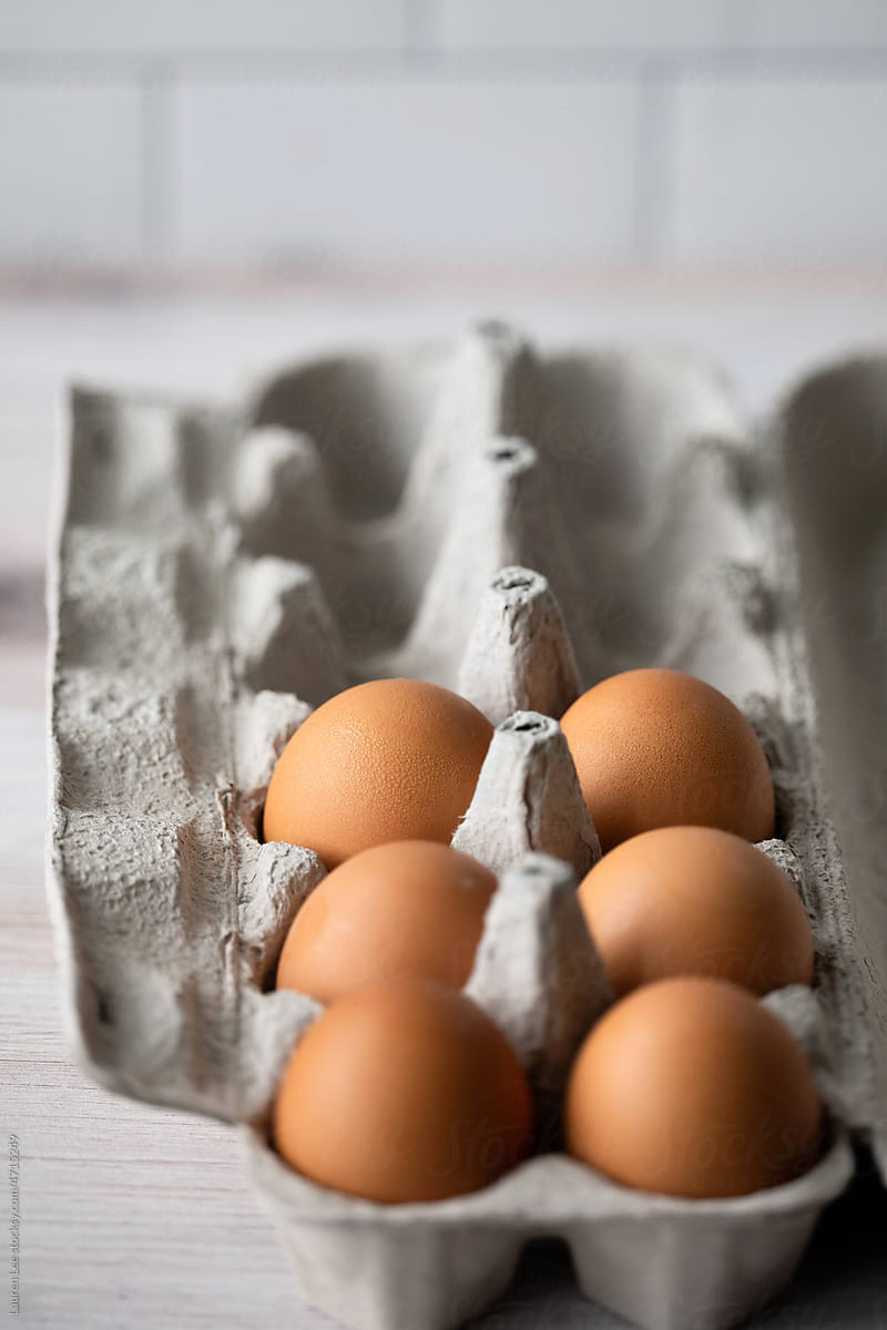 Half carton of eggs on counter