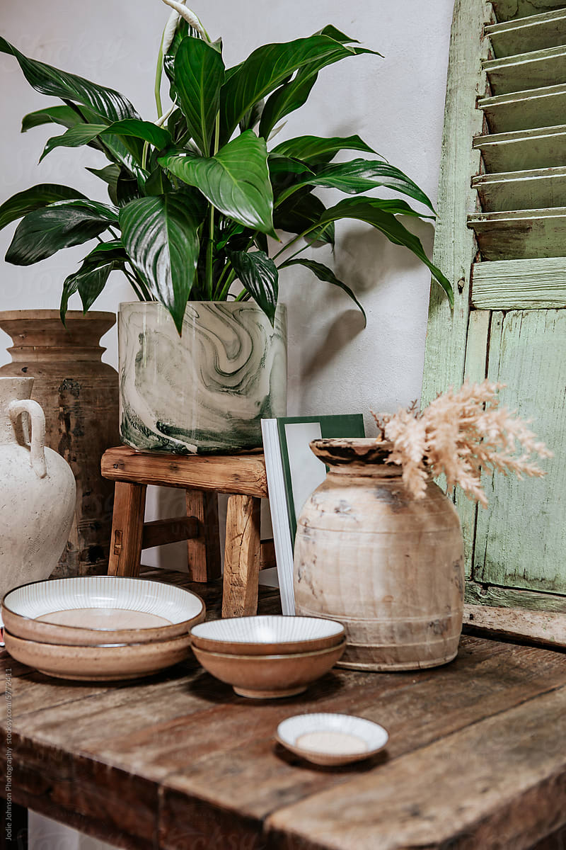 Home decor objects styled on a rustic table