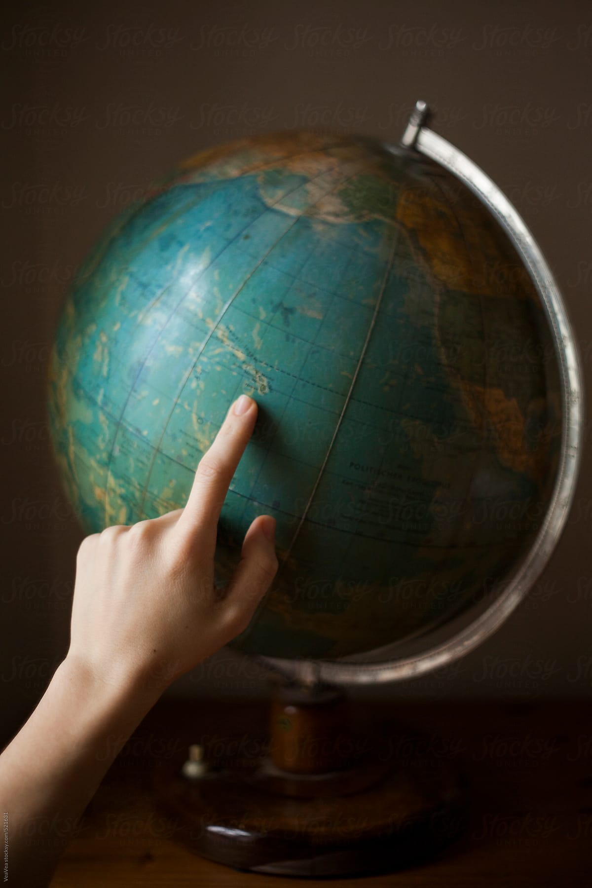 Hand on a globe