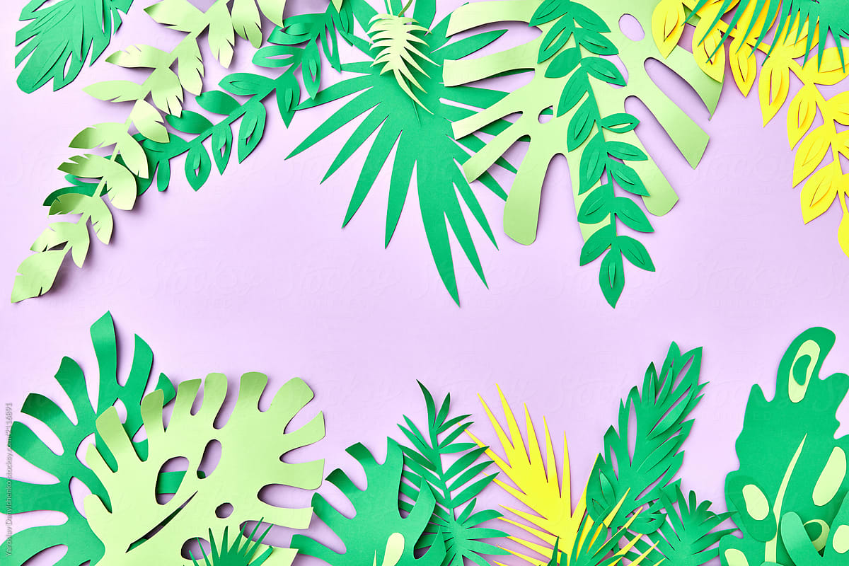 Summer tropical frame of handcraft green leaf from paper on pink