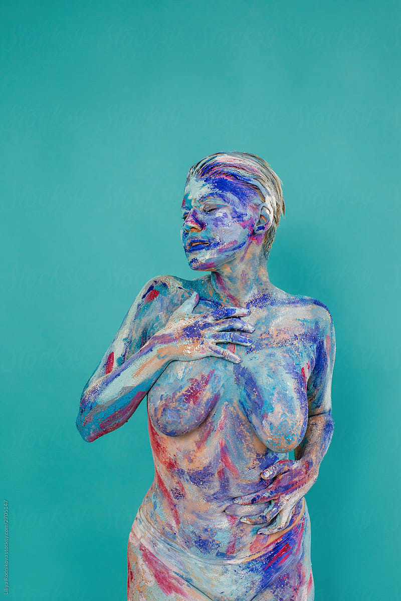 Naked body covered with paints