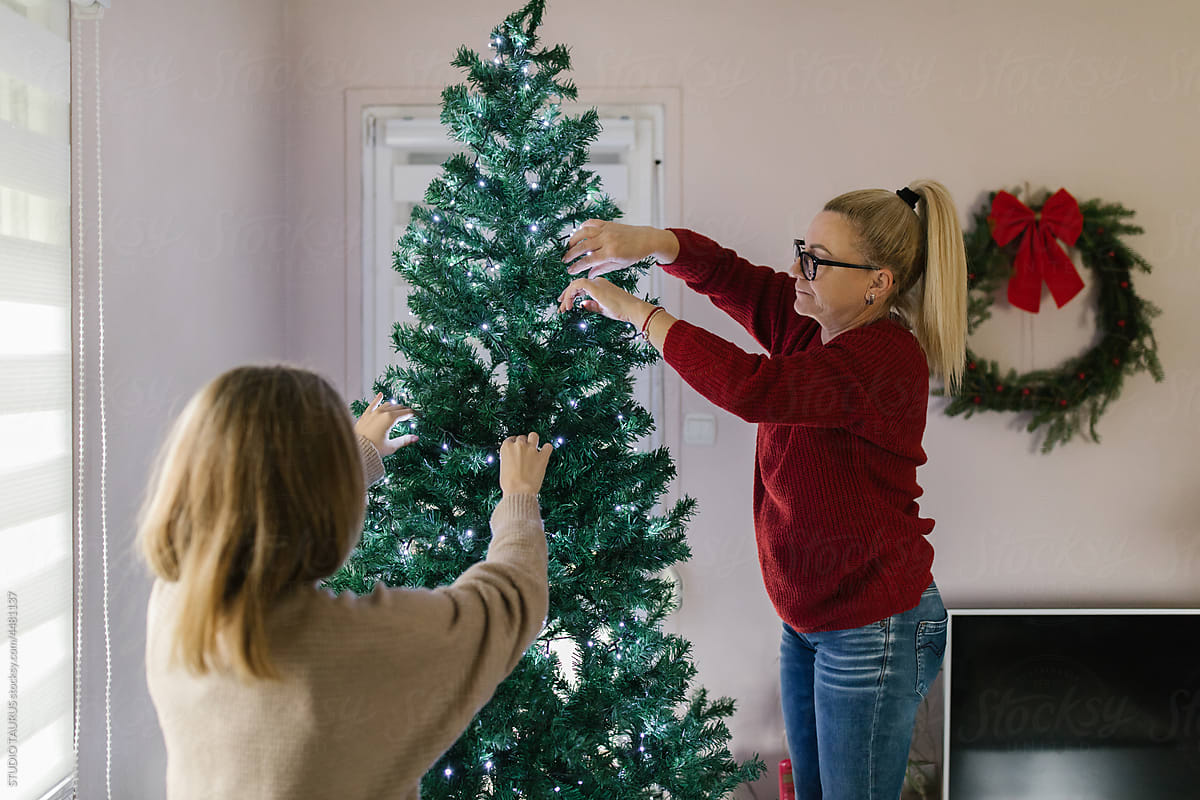 Mother and daughter decorating Christmas at home