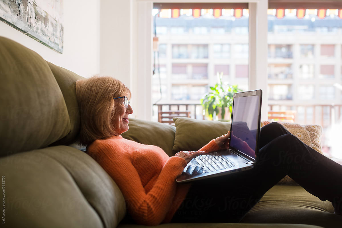Relaxed woman shopping online with laptop