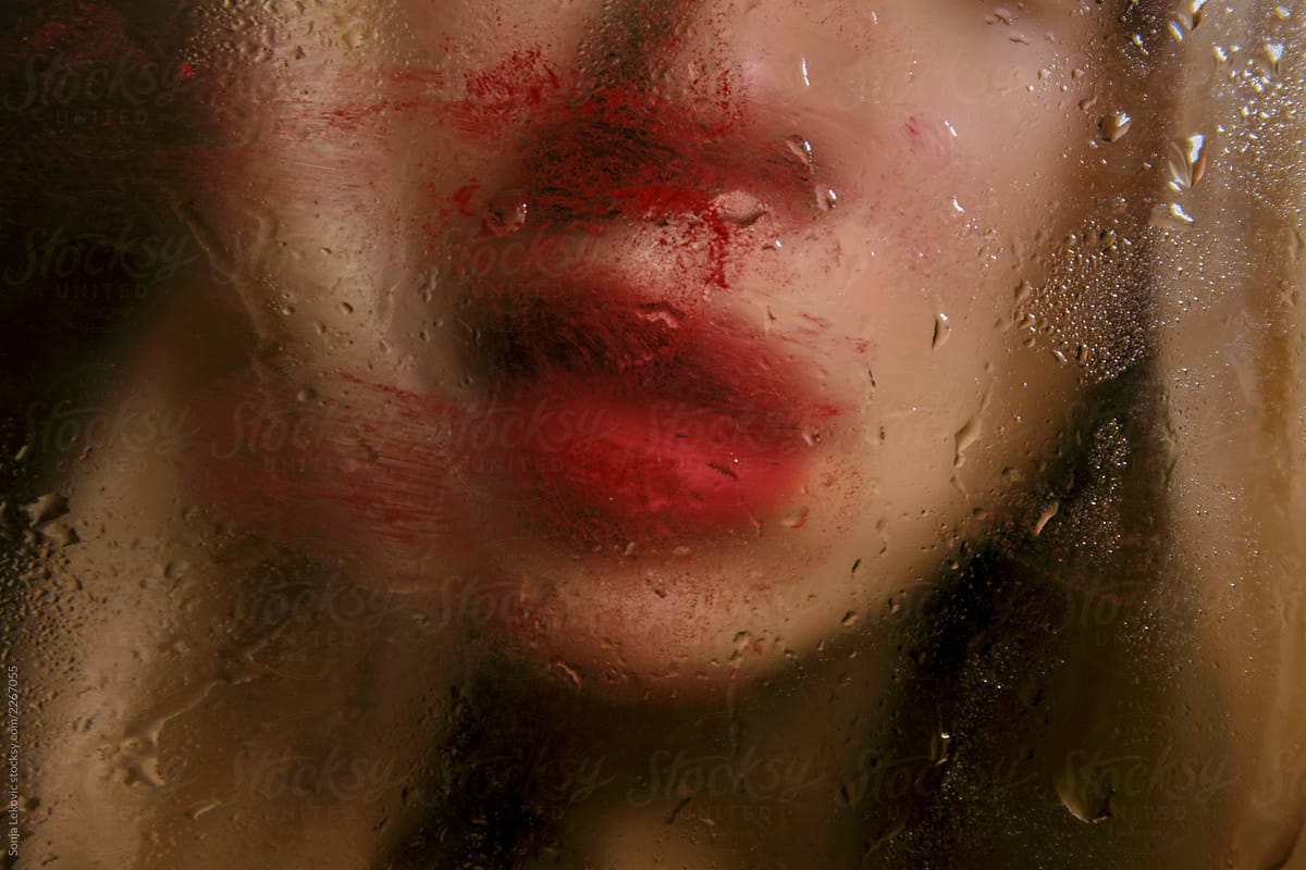 messy red lips and rain drops melancholy beauty closeup