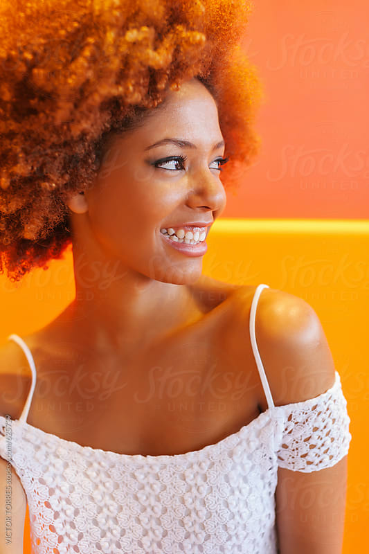 Latin American Afro Woman Against A Colorful Background By Victor